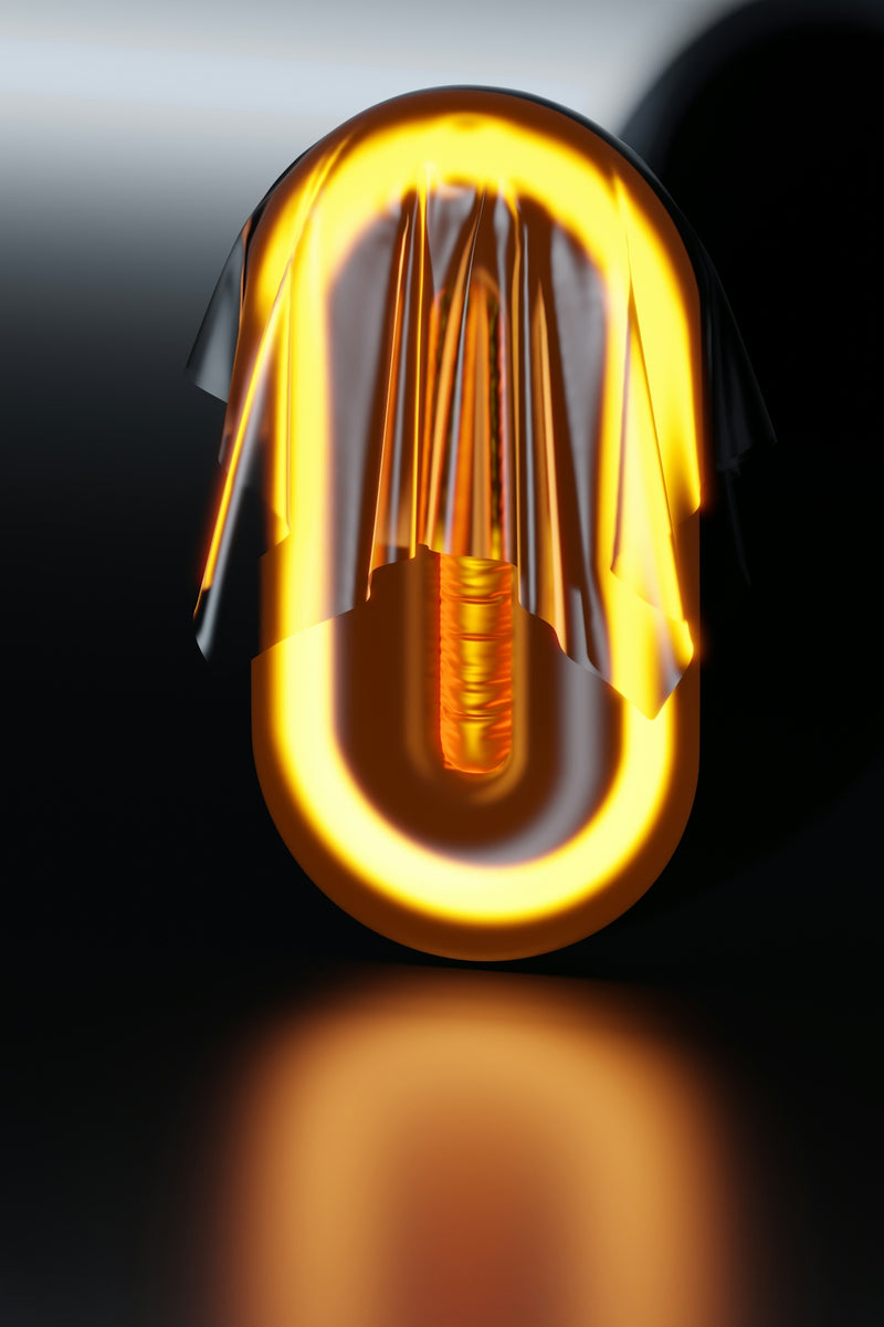 a yellow light bulb with a black background